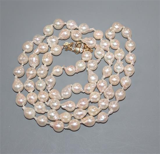 A modern single strand cultured baroque pearl necklace, with 9ct gold and diamond chip set clasp, 65cm